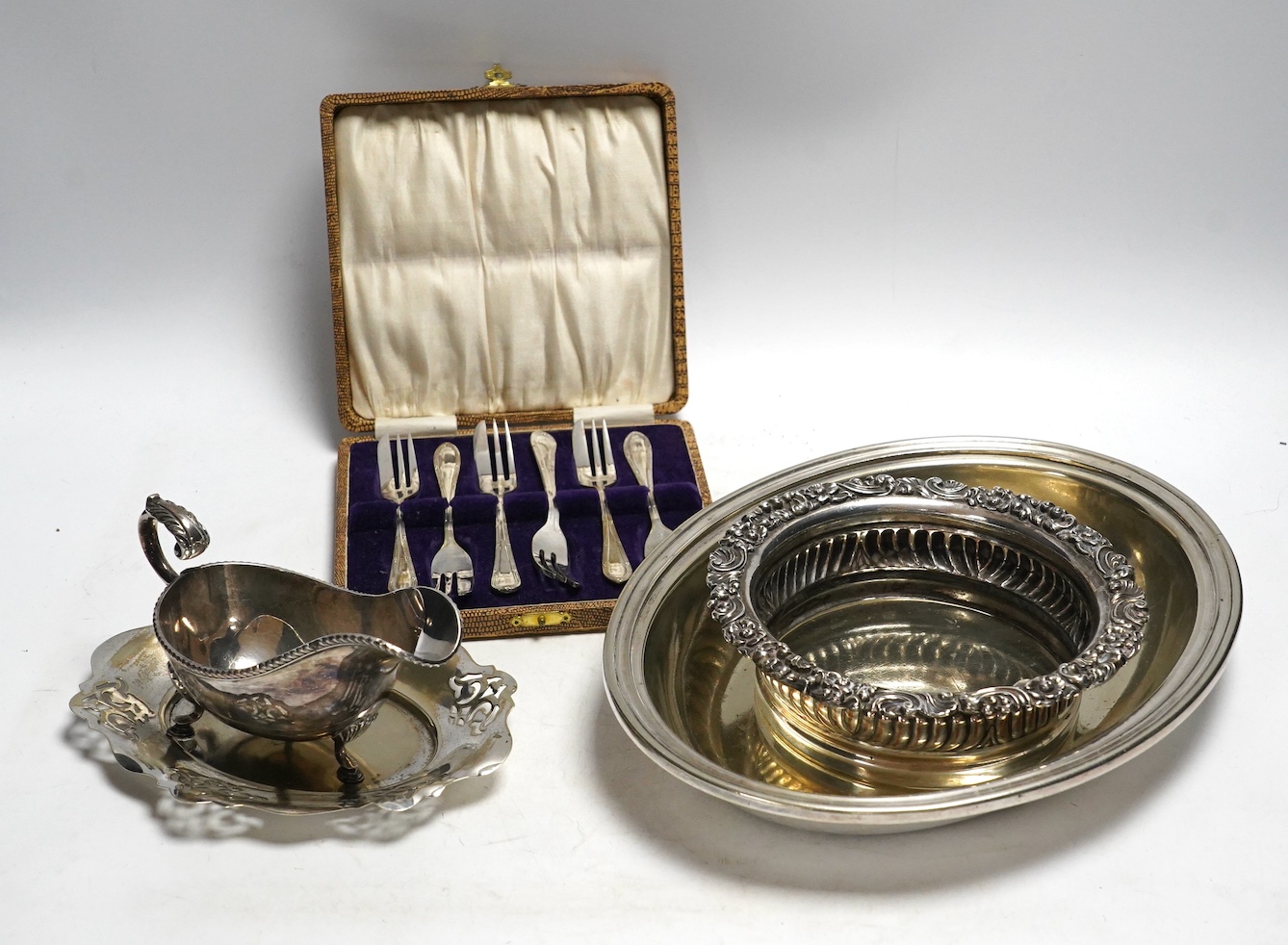 Assorted plated ware including a salver, a sauceboat and a cased set of forks